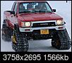 In Nome, a red Toyota pickup with snow tracks-27dd86de-29d1-4873-9176-522d6daf94b3.jpeg
