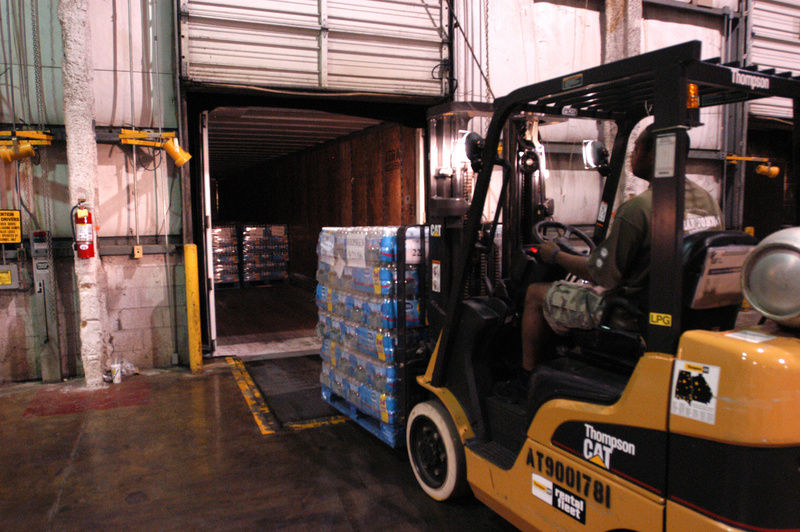A truck is loaded with bottled water at the FEMA Palmetto Regional Distribution...