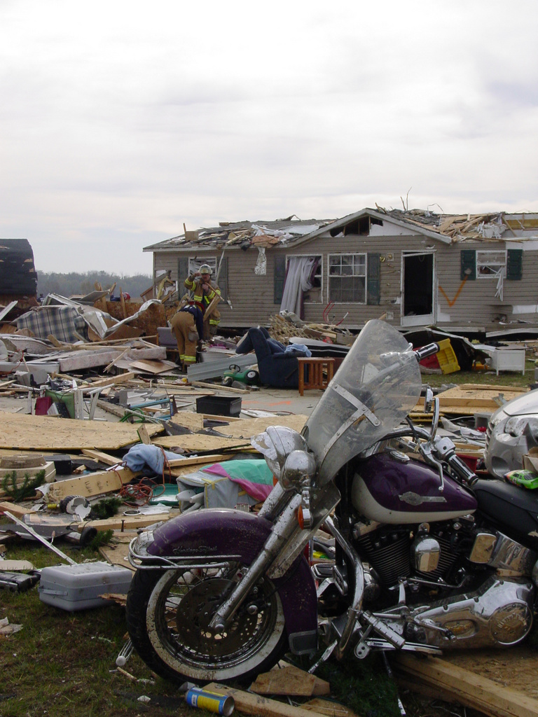 Urban Search and Rescue workers comb through the damaged homes in the...