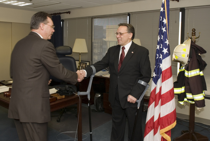 Washington: Stephen Kempf shaking hands with R. David Paulison, the Acting...