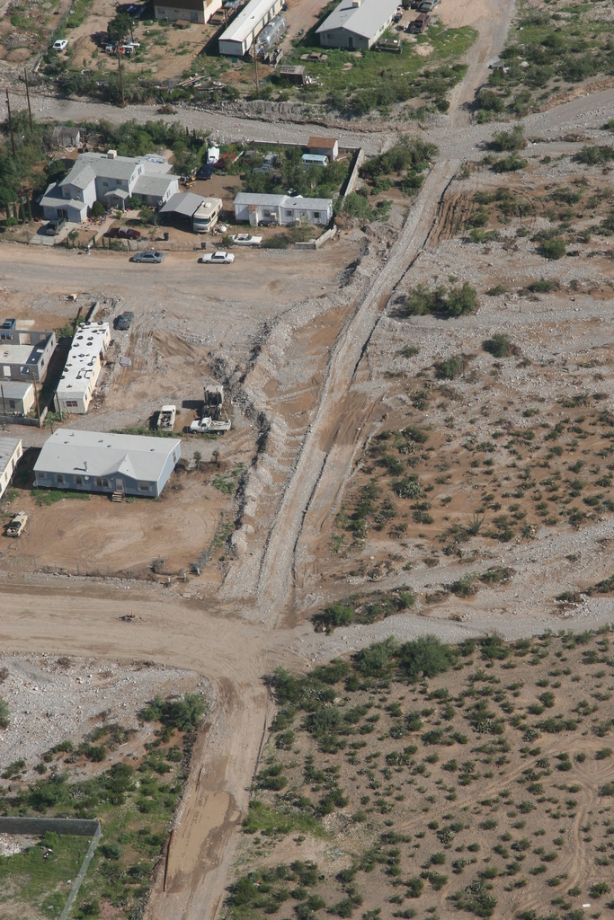 El Paso: Municipalities construct temporary berms between heavy rains...