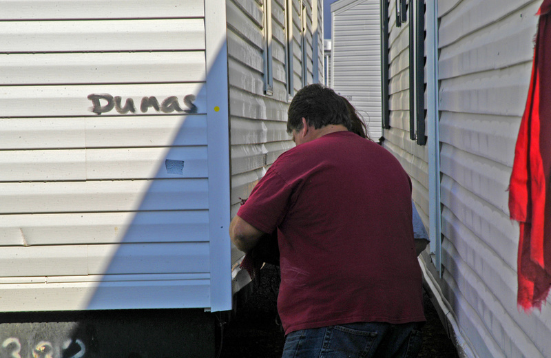 Hope: A mobile home technician conducts a final check on one of 23 mobile...