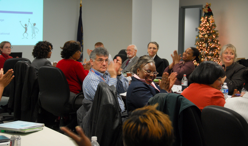 FEMA employees and their mentors applaud as people are being introduced...