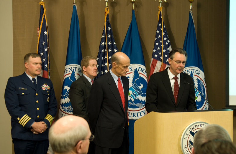 Arlington: Secretary Chertoff (left of podium) listens as FEMA Administrator...
