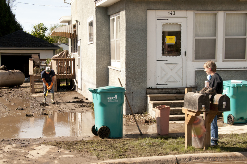 -Homeowners  in Zumbro Falls start to clean up their home which was flooded...