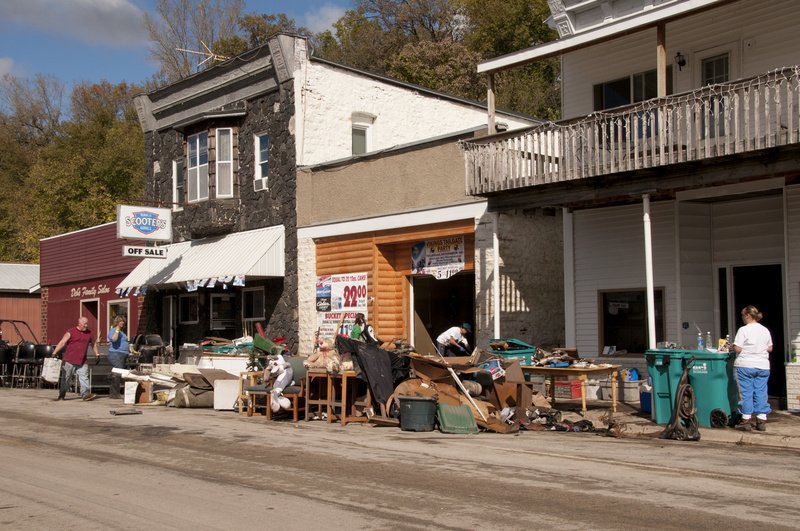 Zumbro Falls: Business owners clean debris from their businesses after...