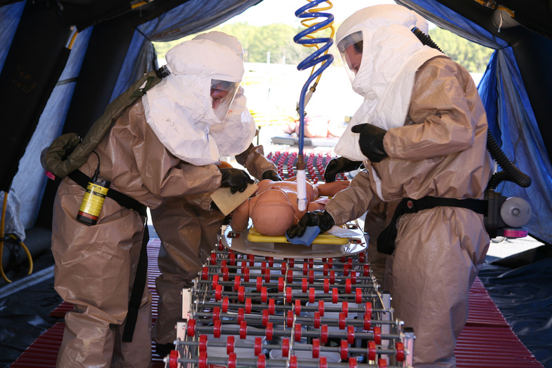 Anniston: Healthcare workers rush to decontaminate a simulated victim...