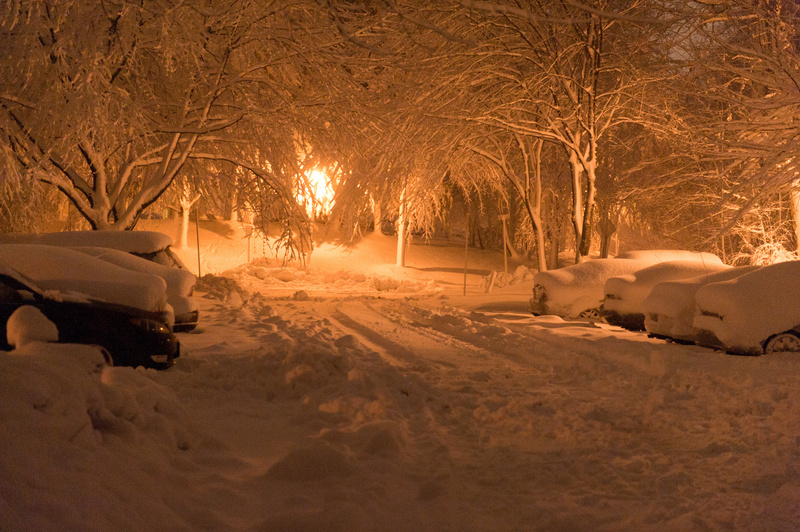 Germantown: Heavy, wet snow blankets cars in a residential neighborhood....