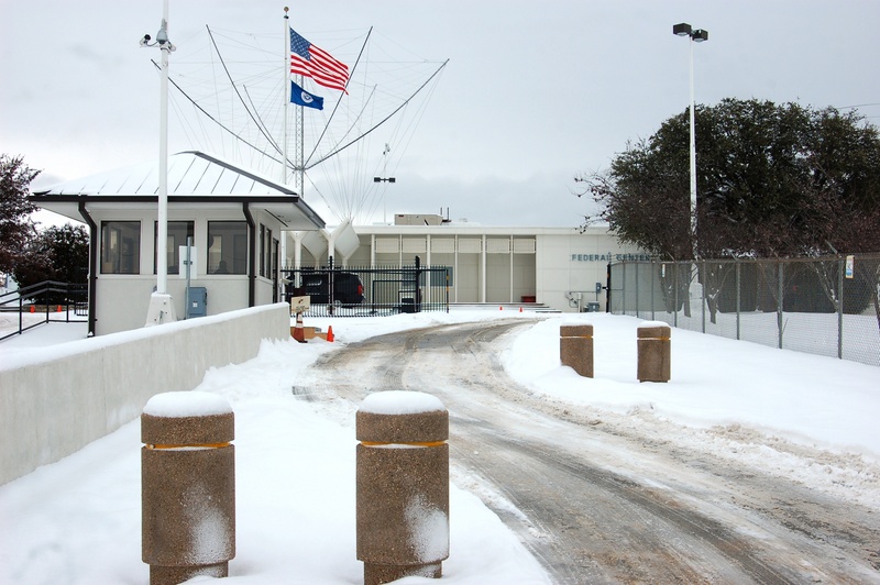 Denton: The sloping driveway to FEMA Region VI was coated with ice and...