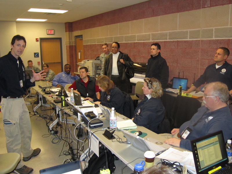 Trenton: Region II IMAT team leader, Tom Fargione (far left), discusses...