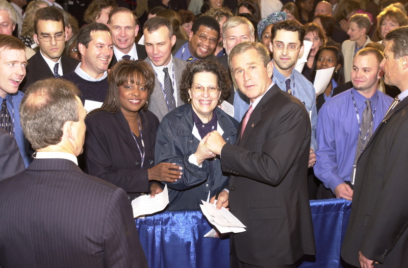 Washington: President Bush signs autographs and poses with FEMA employees...