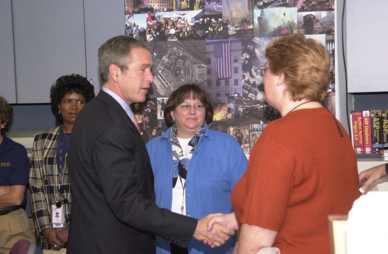 Washington: President Bush shakes hands with FEMA staff in the Emergency...
