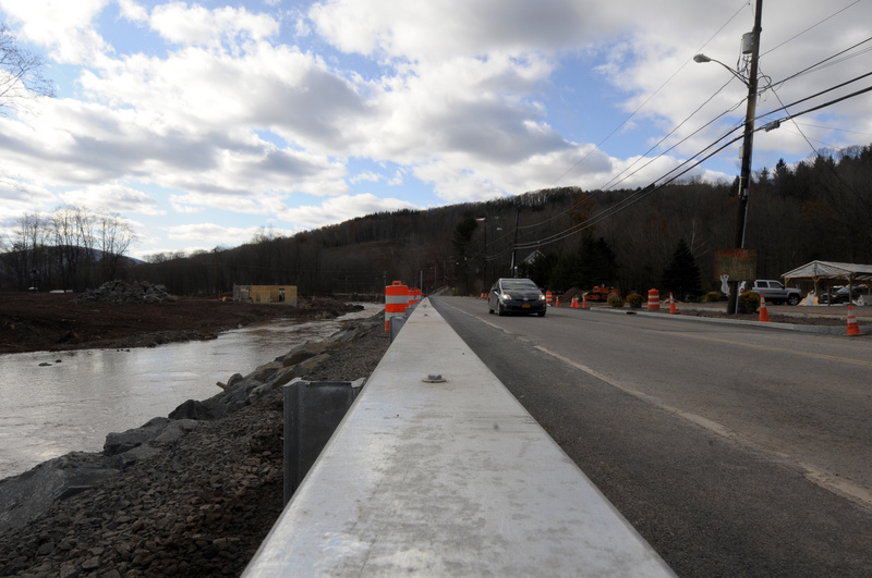 Windham: Crews installed new guardrails and a rock embankment along the...