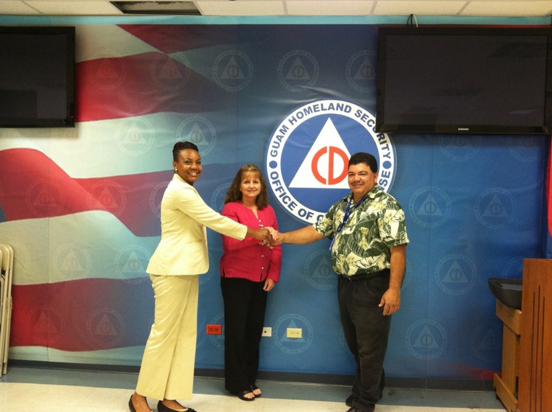 Guam EOC Director James McDonald with and Program Analyst Xushie Brue...