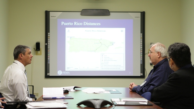 FEMA Administrator Craig Fugate receives  briefing from CAD Director Alejandro...