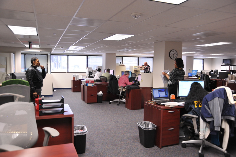 Employees working in FEMA HQ newly renovated open offices.