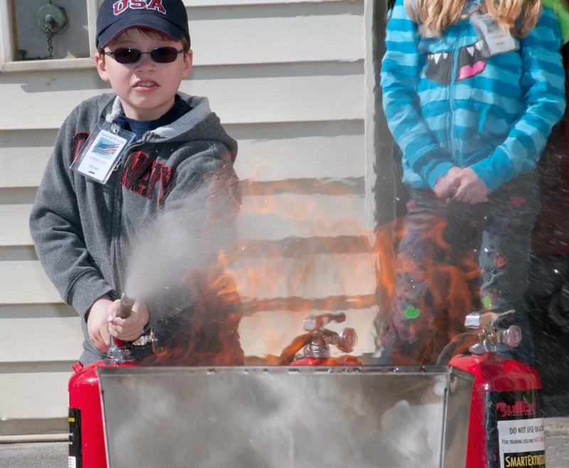 Kids even got to extinguish a controlled propane fire . . . under the...