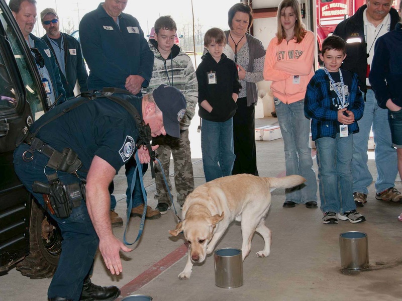 Demonstrating the skills of the K9 unit is a crowd pleaser: Kids and dogs,...