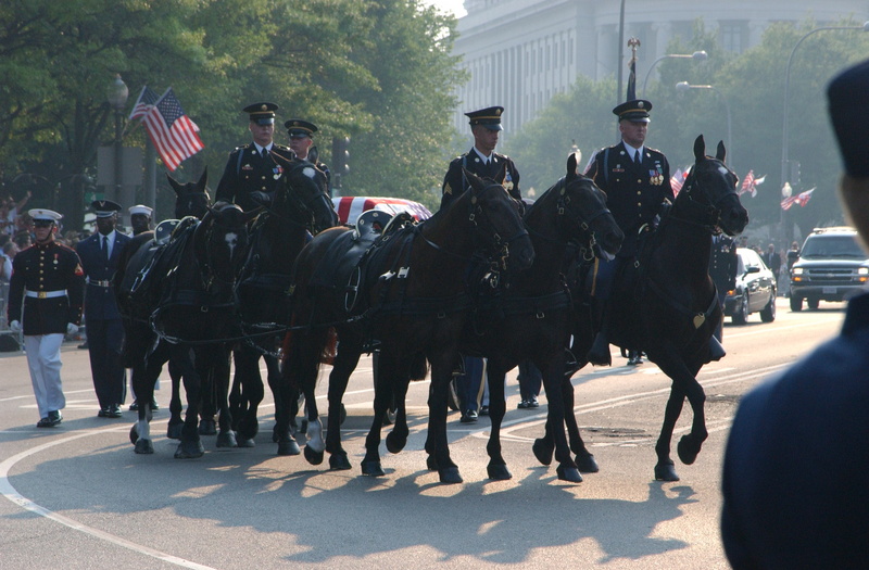 Washington: A military honor guard escorts the casket bearing the body...
