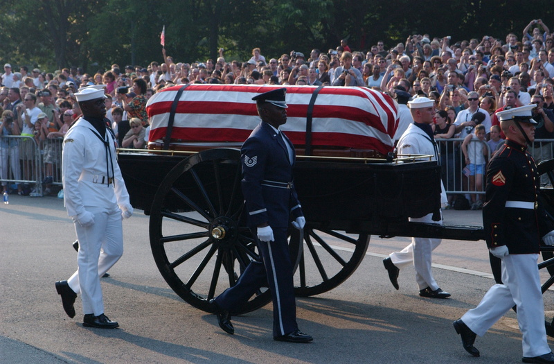 Washington: A military honor guard escorts the casket bearing the body...