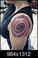 How much would these tattoos cost?  don't have any yet-black-hole-tattoo.jpg