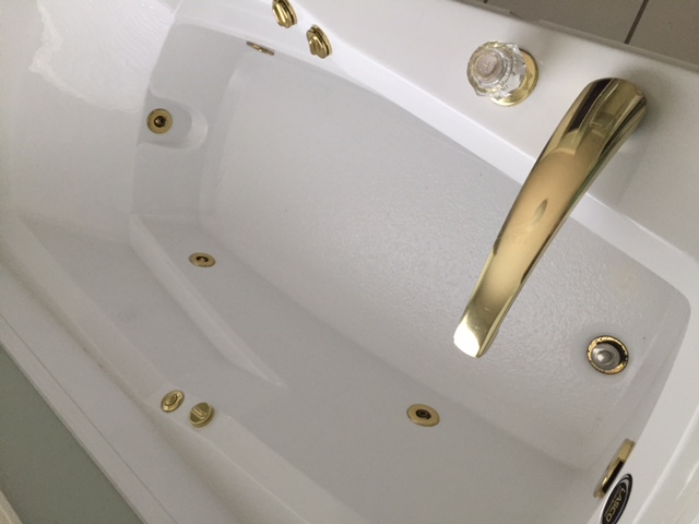 Older Jetted Tub With Brass Fixtures Ceiling Tile Shower