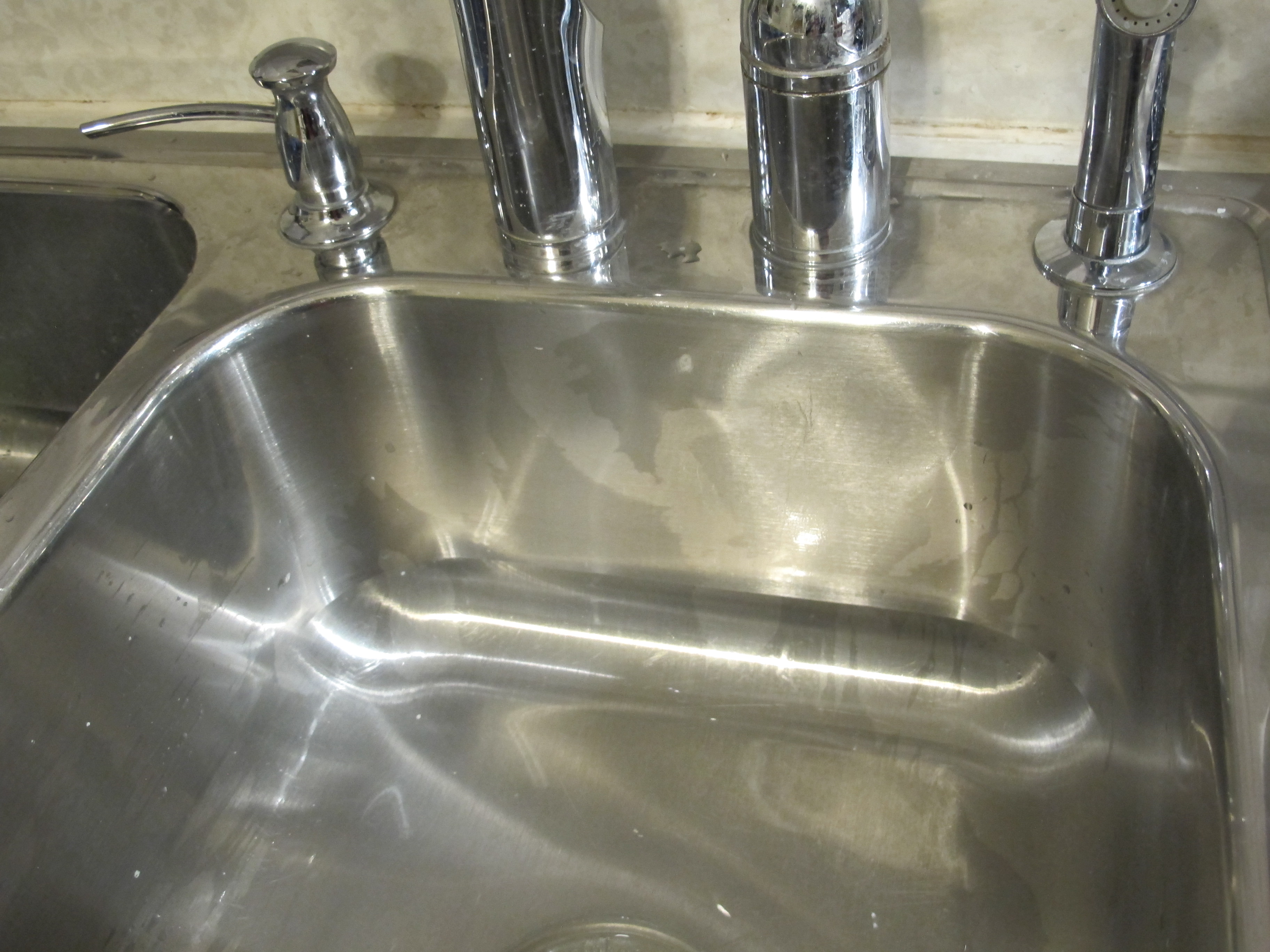recaulking a kitchen sink