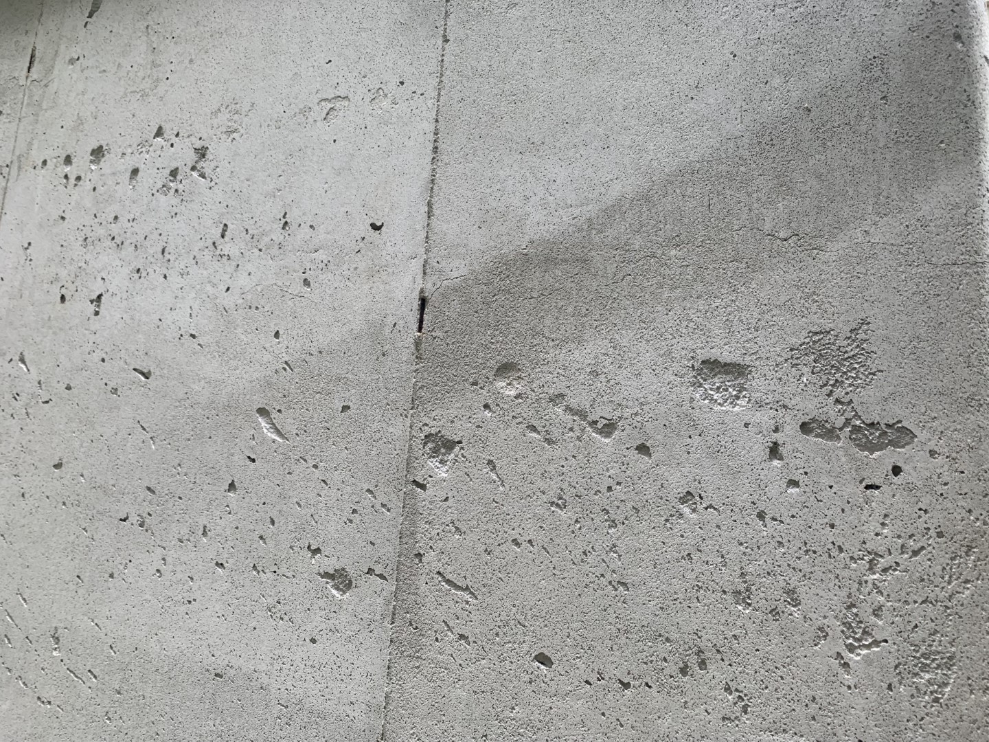 Hairline cracks on outside of above grade concrete foundation (paint