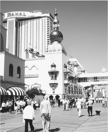 Atlantic Citys popular boardwalk offers shops, amusement stands, and entertainment piers.